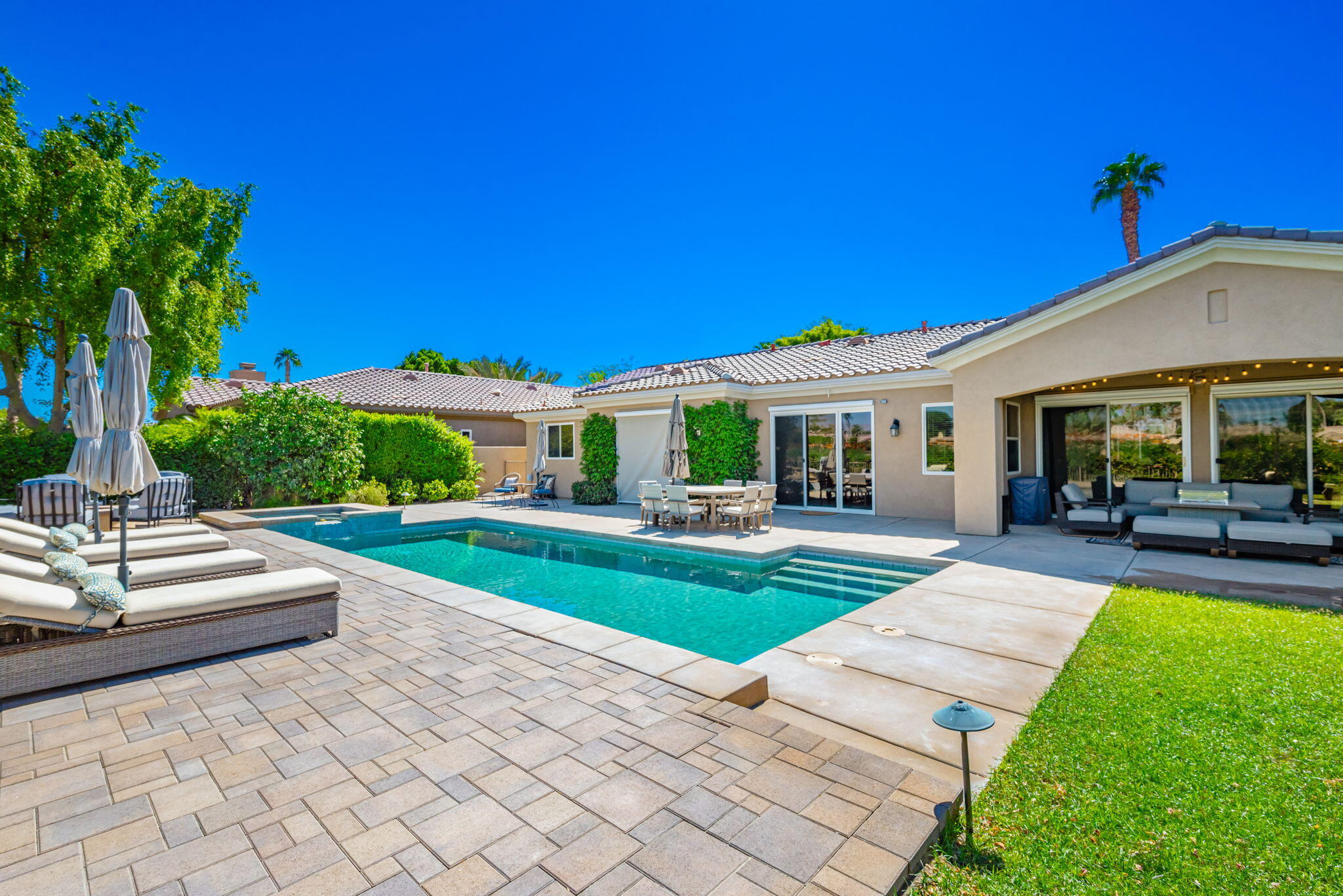 81260 Golf View Drive La Quinta, CA 92253 - Photo 45 of 58 a view of a house with a yard porch and sitting area