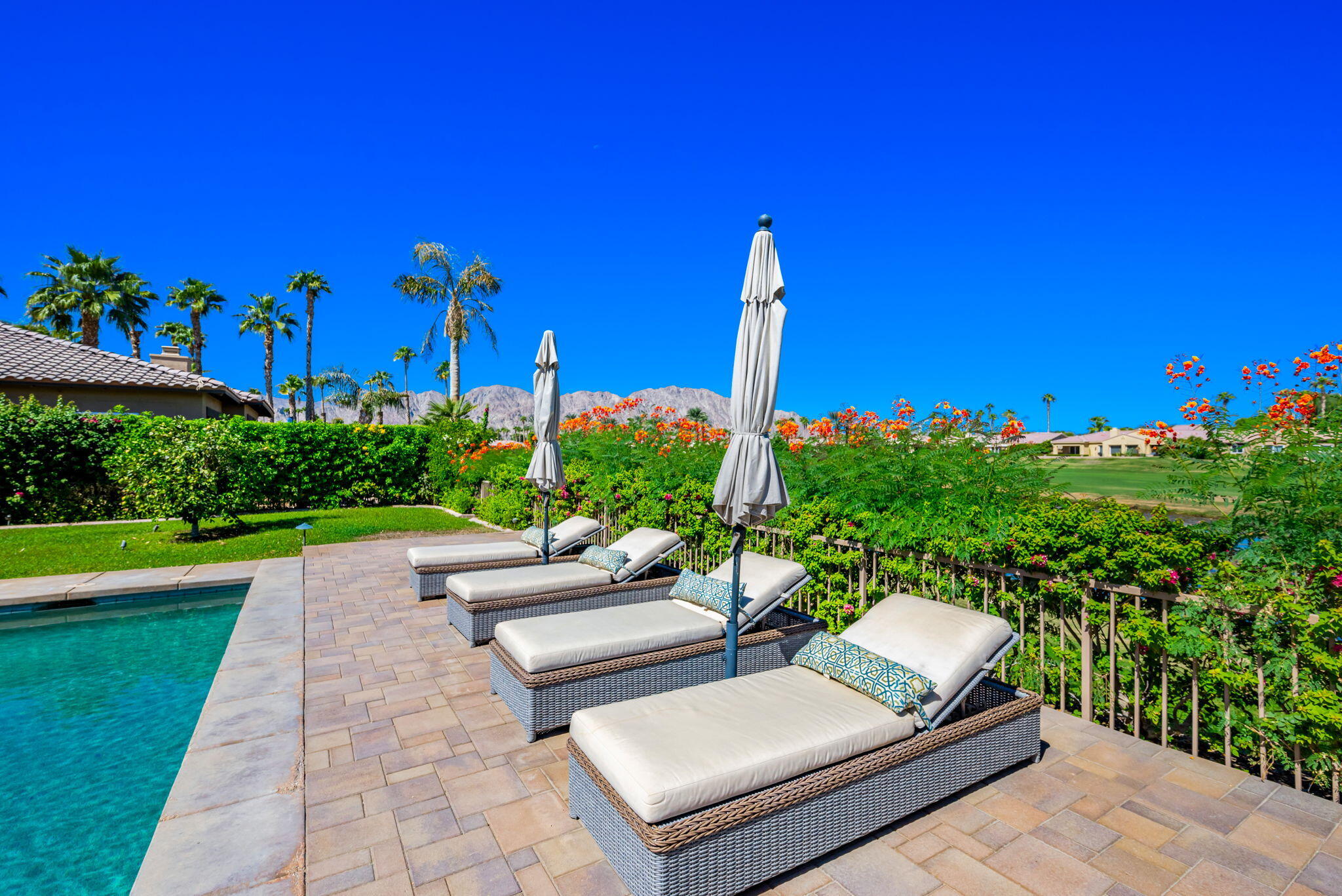 81260 Golf View Drive La Quinta, CA 92253 - Photo 46 of 58 a view of a patio with couches table and chairs with plants