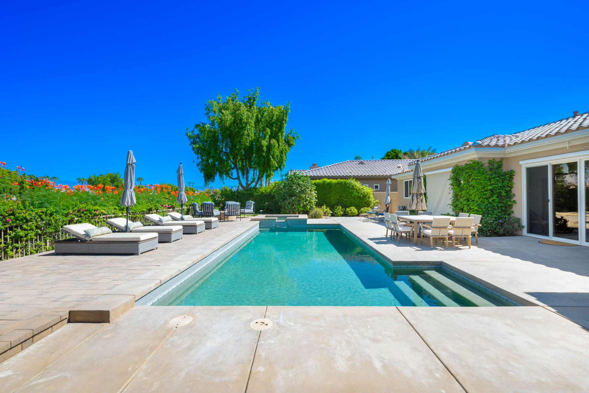 81260 Golf View Drive La Quinta, CA 92253 - Photo 47 of 58 a view of backyard with swimming pool and outdoor seating