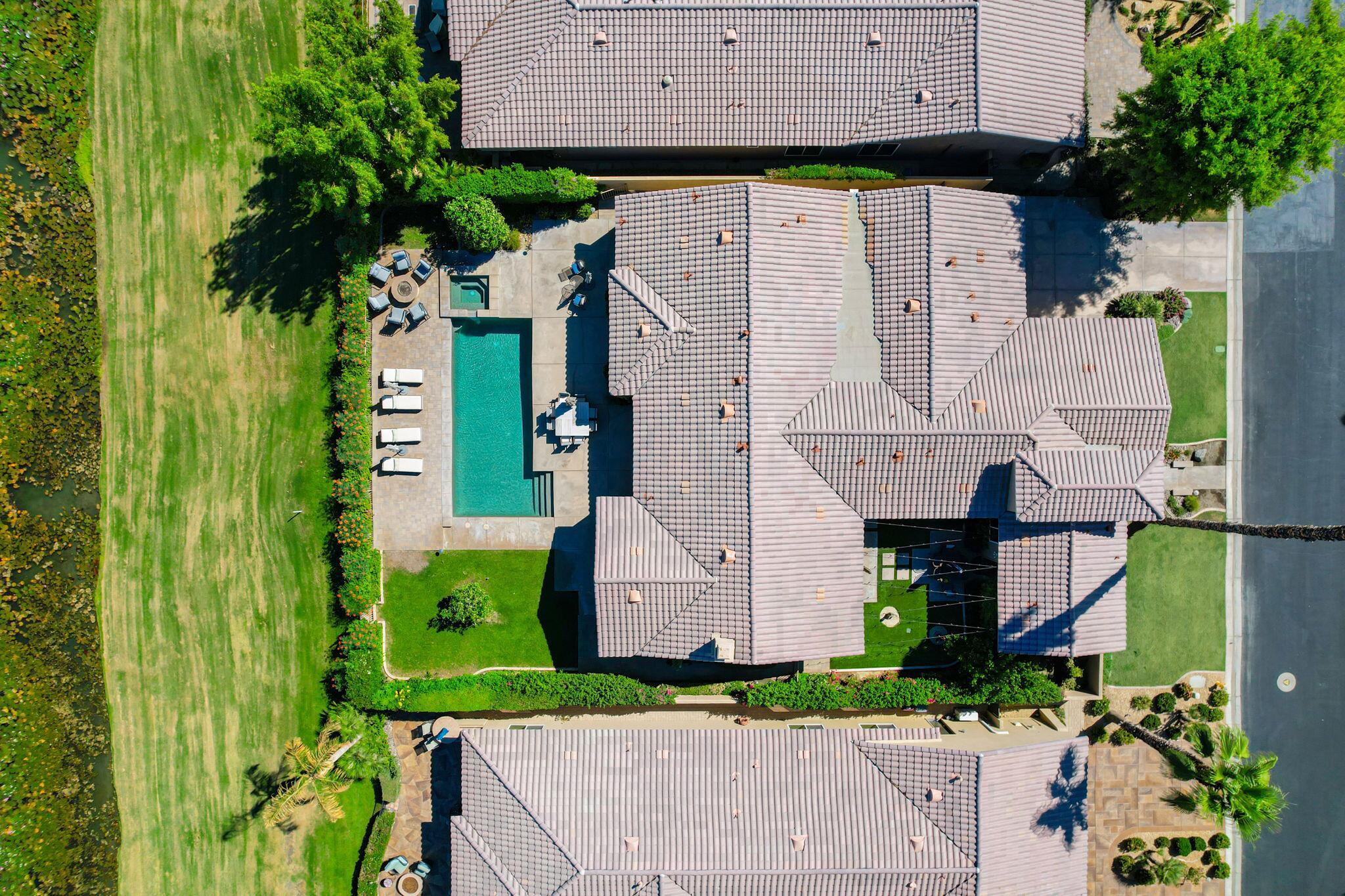81260 Golf View Drive La Quinta, CA 92253 - Photo 49 of 58 an aerial view of a house with a garden and plants
