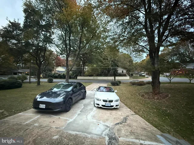 a view of a kitchen with kitchen island a counter top space a sink and appliances