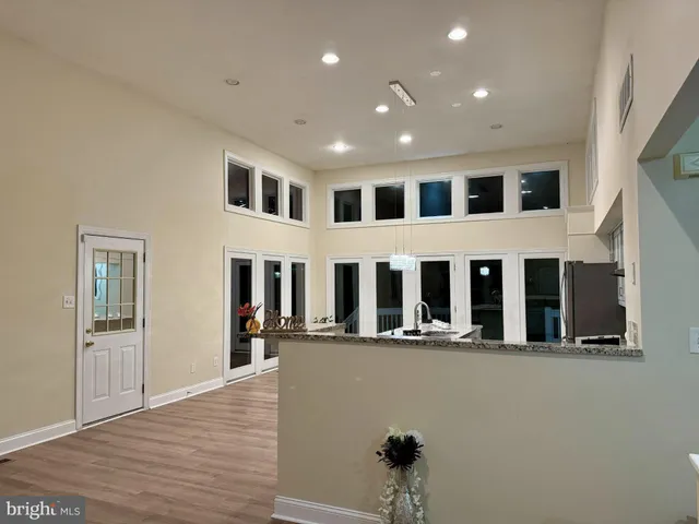 a kitchen with stainless steel appliances granite countertop a stove and a sink