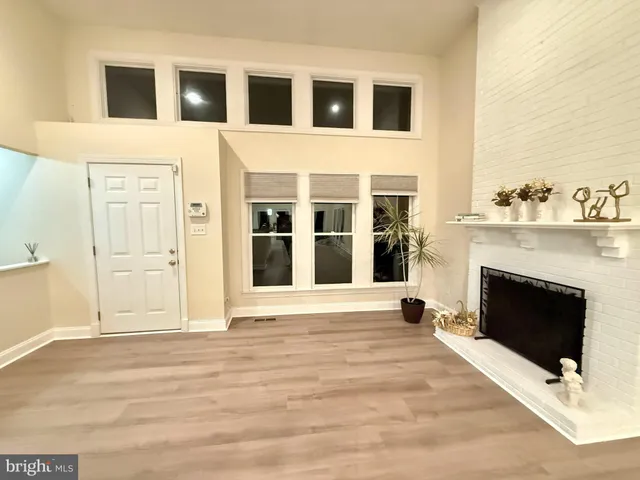 a bathroom with a double vanity sink toilet mirror and bathtub