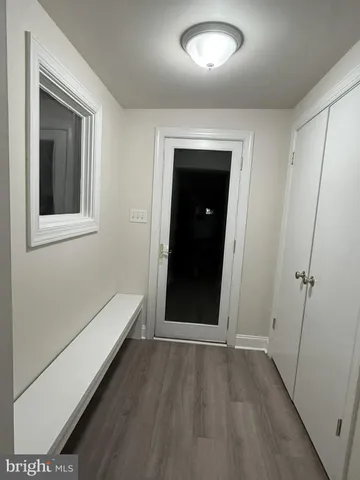 a bathroom with a granite countertop sink a toilet and a mirror