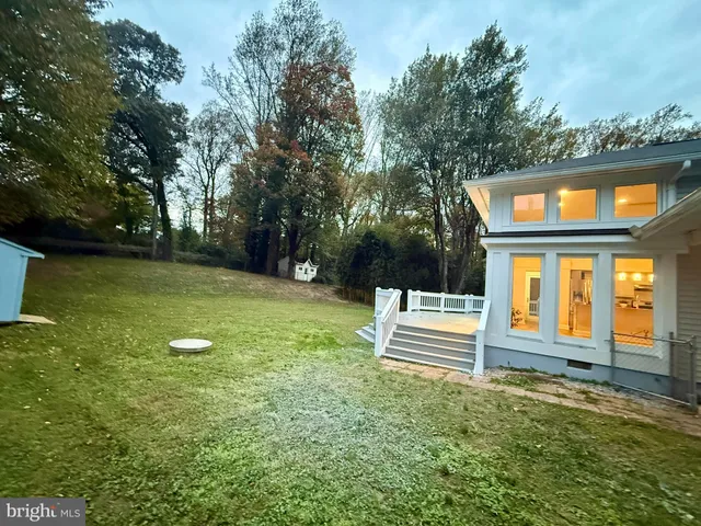 a view of a house with a back yard