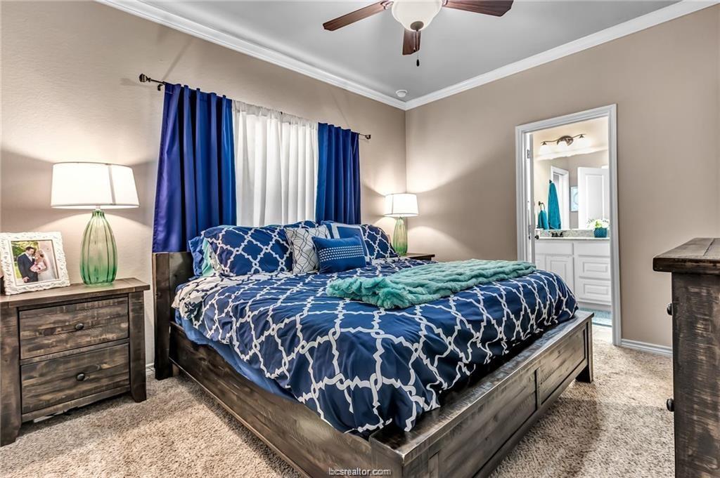 1800 Lonetree Drive College Station, TX 77845 - Photo 12 of 23 a bedroom with a large bed and a window