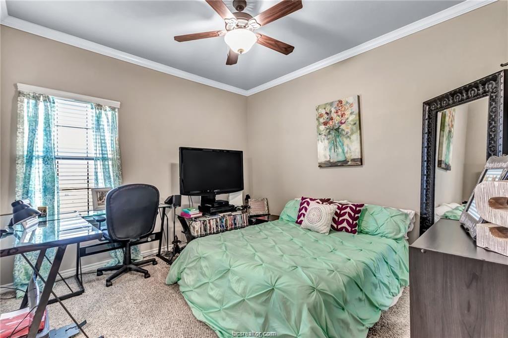1800 Lonetree Drive College Station, TX 77845 - Photo 18 of 23 a bedroom with a bed and a chair