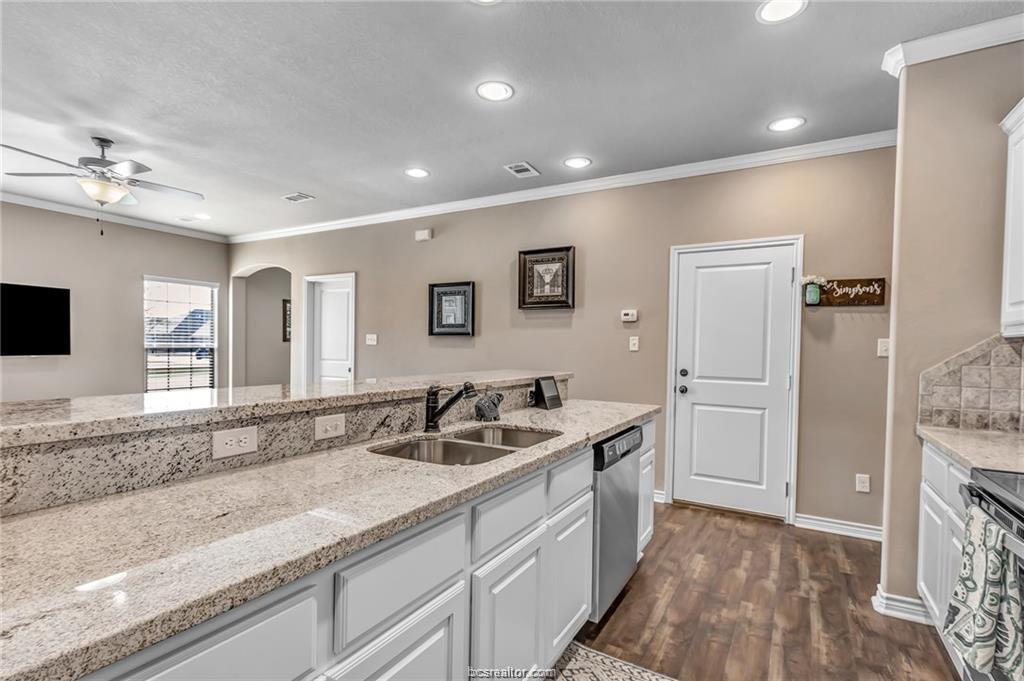 1800 Lonetree Drive College Station, TX 77845 - Photo 6 of 23 a bathroom with a granite countertop sink and a mirror