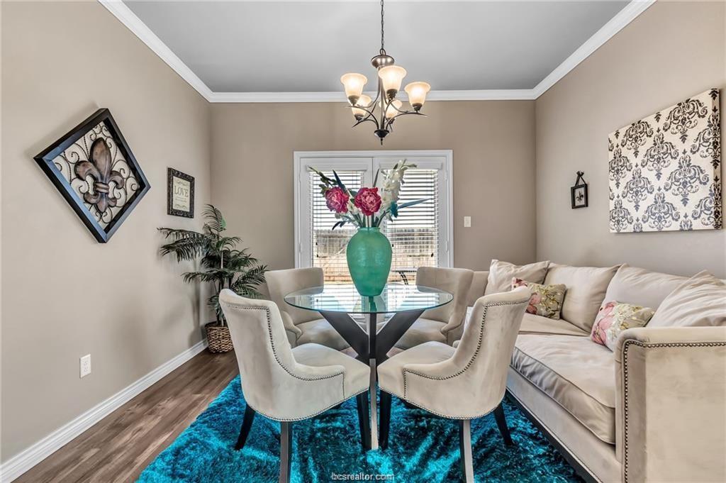 1800 Lonetree Drive College Station, TX 77845 - Photo 10 of 23 a living room with furniture and a chandelier