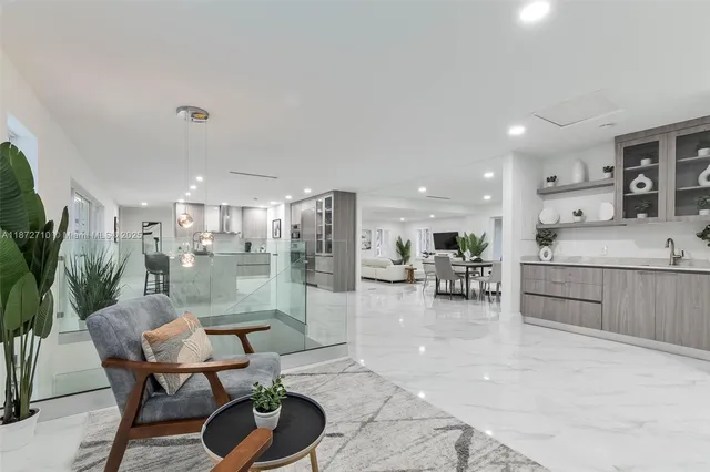 a kitchen with a table and chairs