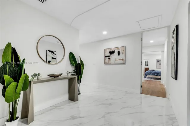 a view of a living room and bathroom