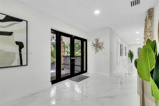 a view of entryway with livingroom and hallway