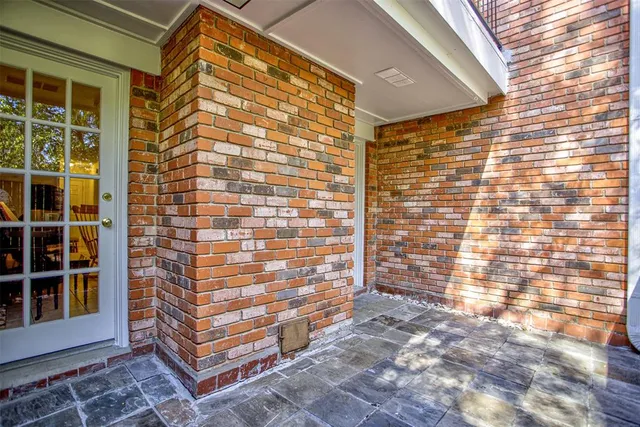a view of outdoor space with wooden floor and windows