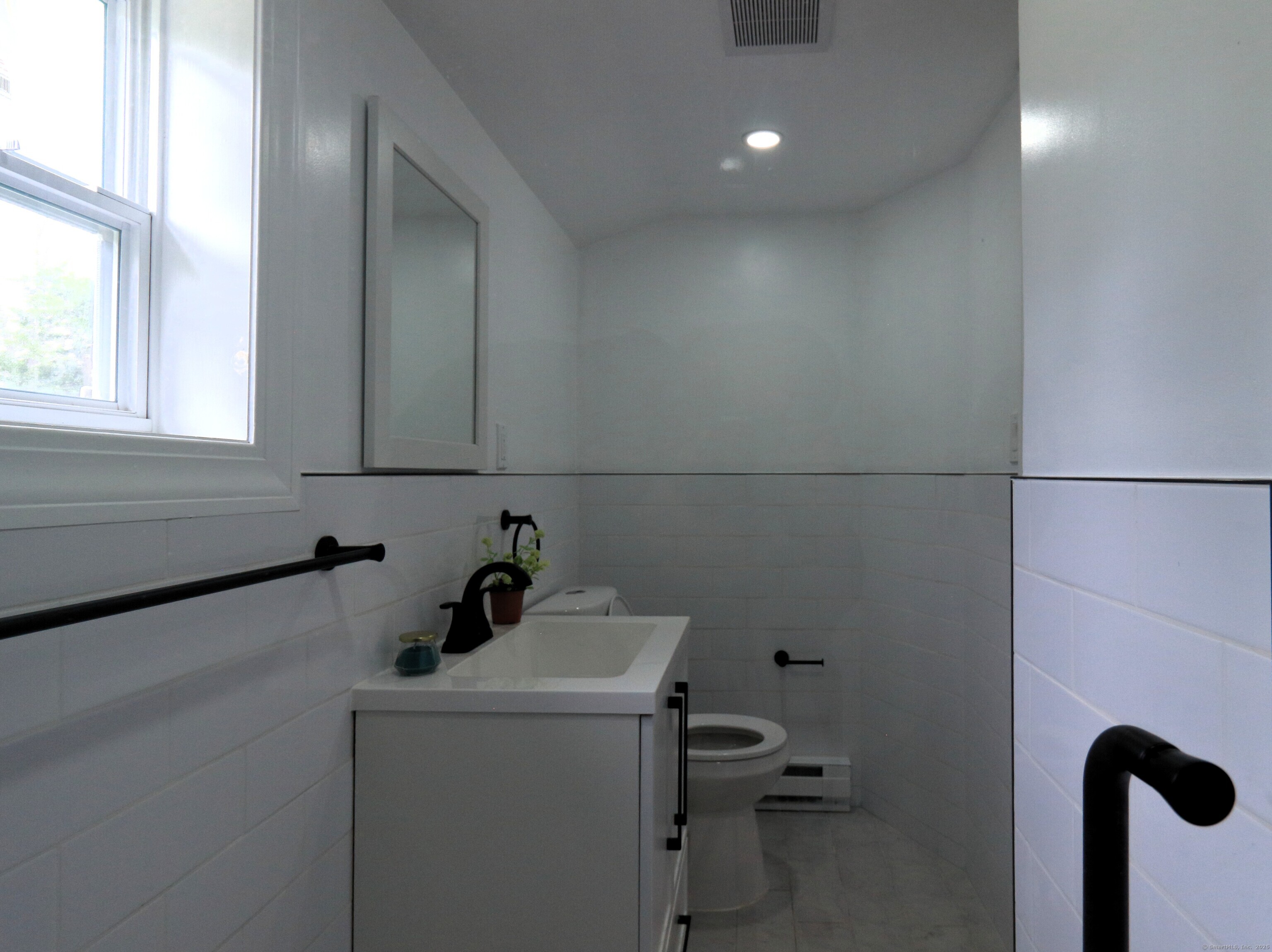 618 Beach Street Goshen, CT 06756 - Photo 12 of 25 a bathroom with a sink and a toilet