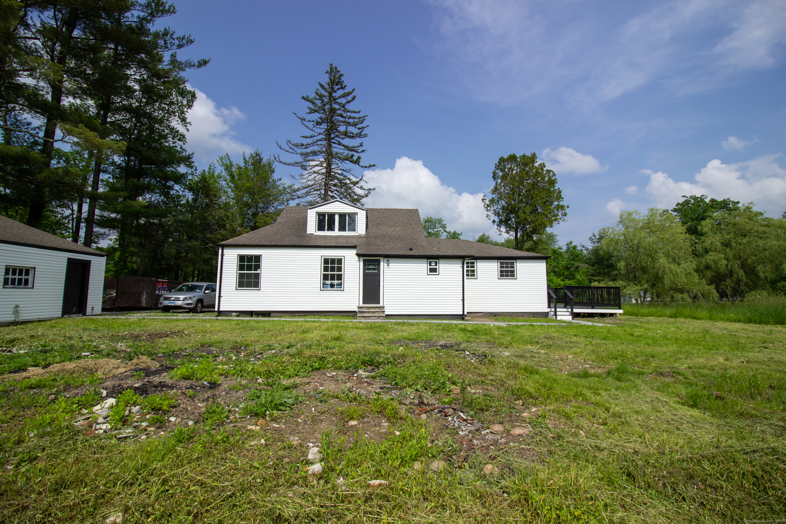 618 Beach Street Goshen, CT 06756 - Photo 16 of 25 a house with green field in front of it