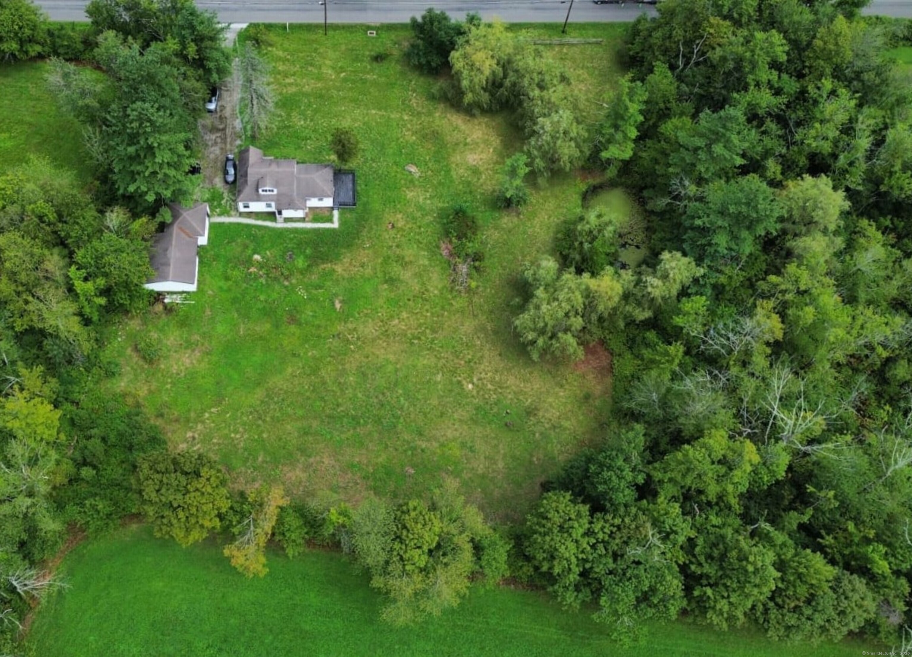 618 Beach Street Goshen, CT 06756 - Photo 24 of 25 an aerial view of residential house with outdoor space and trees all around