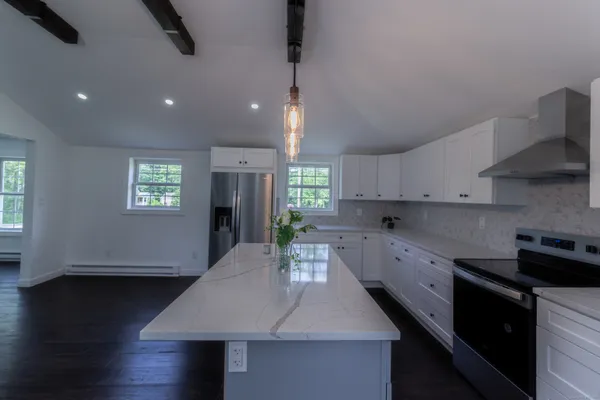 a kitchen with counter space cabinets and appliances