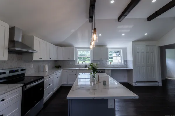 a kitchen with granite countertop lots of counter top space