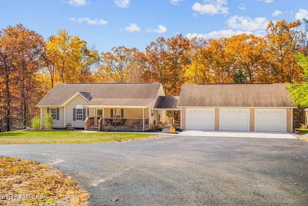 a house that has a big yard and large trees