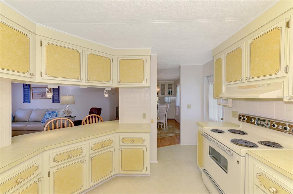 322 Robalo North Port, FL 34287 - Photo 16 of 57 a kitchen with stainless steel appliances granite countertop a sink and cabinets