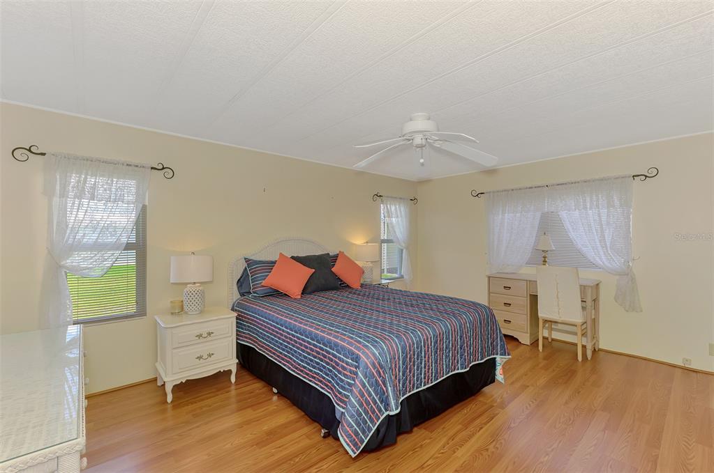 322 Robalo North Port, FL 34287 - Photo 18 of 57 a bedroom with a bed and a table in it