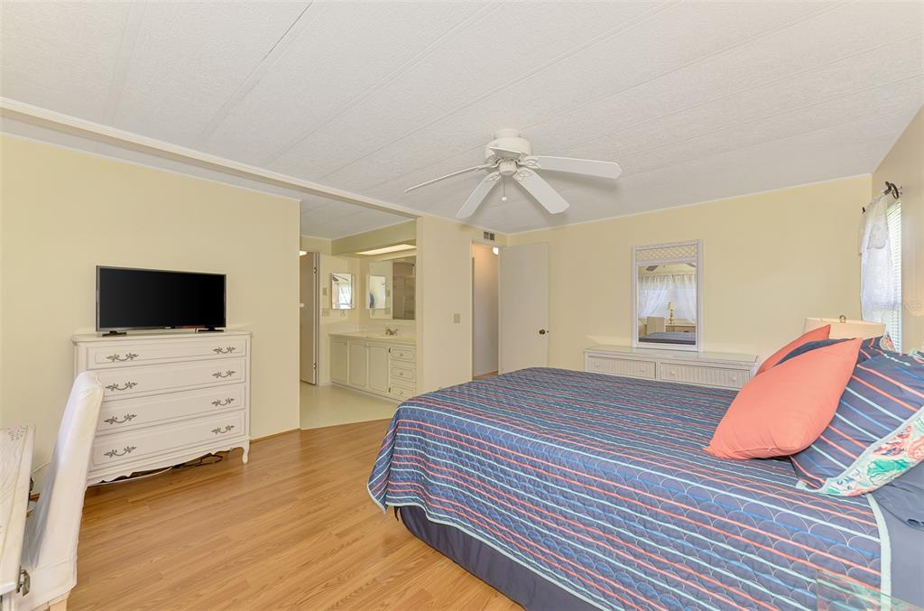322 Robalo North Port, FL 34287 - Photo 21 of 57 a bedroom with a bed and a flat screen tv