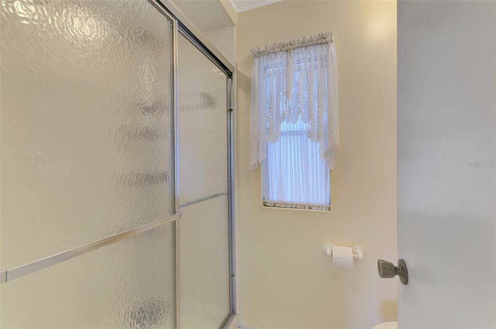 322 Robalo North Port, FL 34287 - Photo 23 of 57 a bathroom with a shower and a door