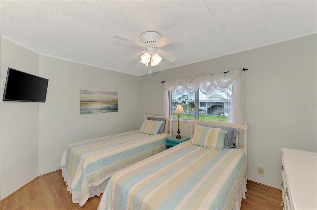 322 Robalo North Port, FL 34287 - Photo 25 of 57 a bedroom with bed tv and window
