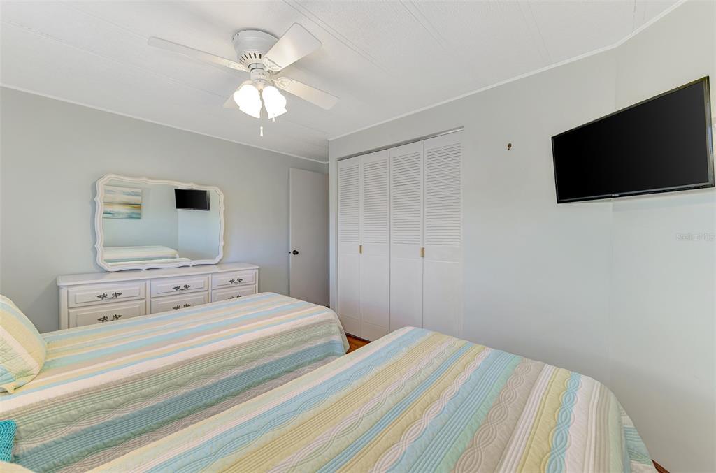 322 Robalo North Port, FL 34287 - Photo 26 of 57 a bedroom with a bed and a flat screen tv