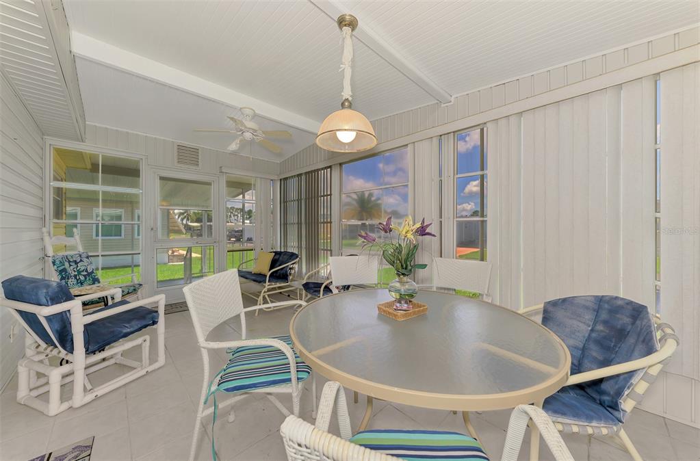 322 Robalo North Port, FL 34287 - Photo 28 of 57 a living room with furniture a window and a chandelier