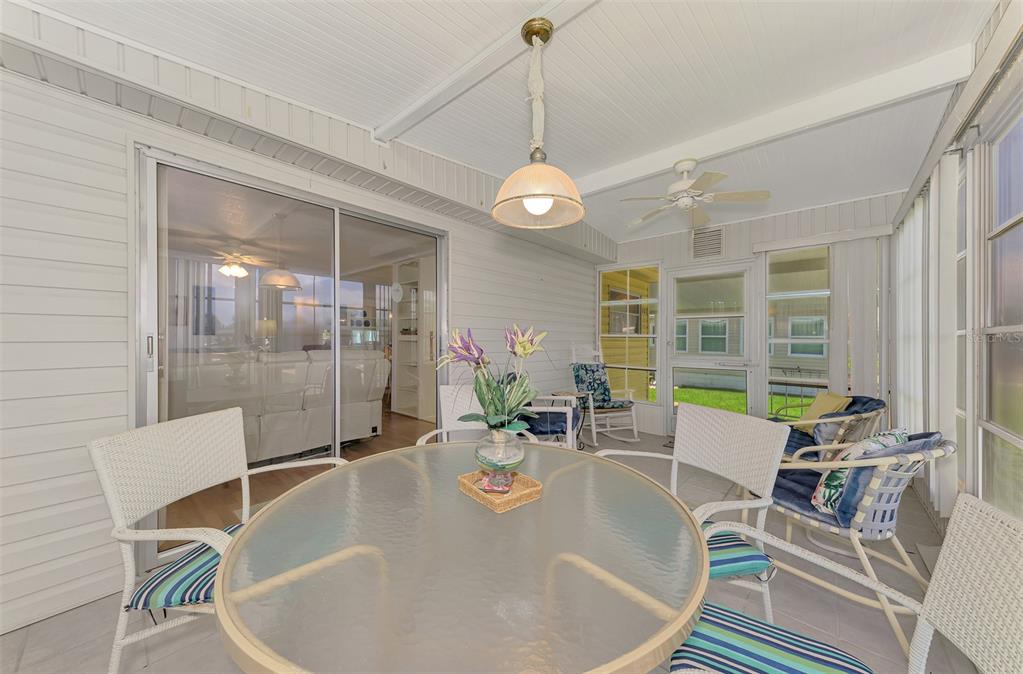 322 Robalo North Port, FL 34287 - Photo 29 of 57 a dining room with furniture a chandelier and window