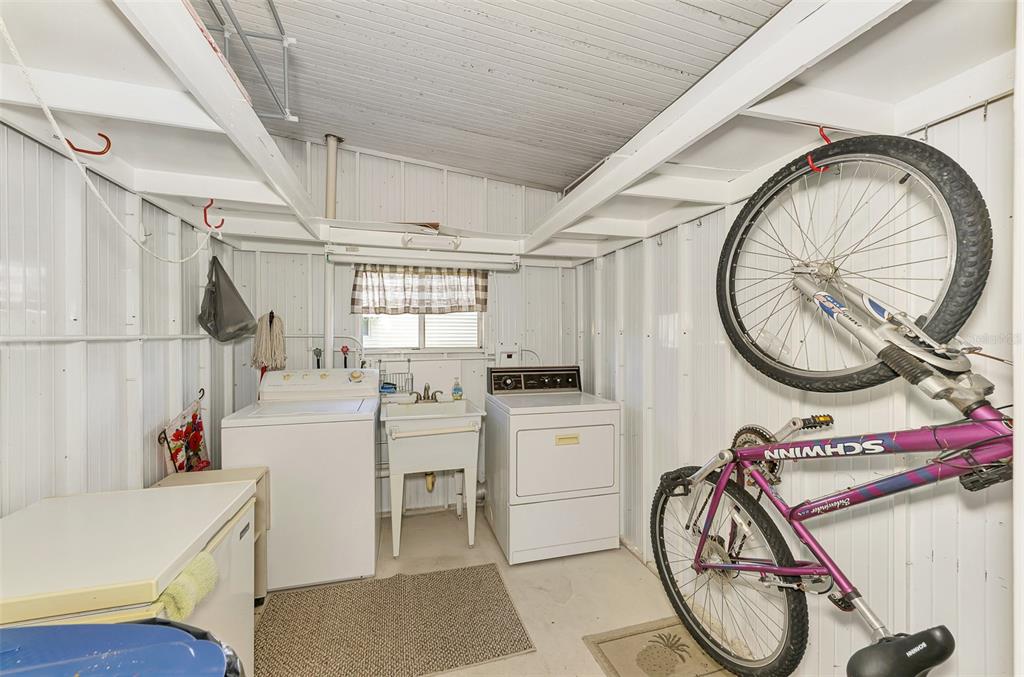 322 Robalo North Port, FL 34287 - Photo 32 of 57 a storage room with washer and dryer