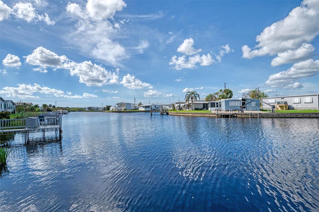 322 Robalo North Port, FL 34287 - Photo 35 of 57 a view of a lake with outdoor seating