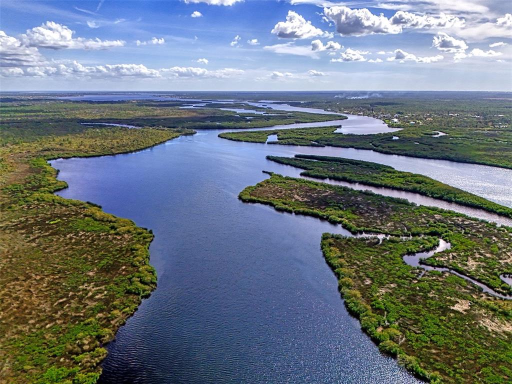 322 Robalo North Port, FL 34287 - Photo 41 of 57 a view of a lake with a yard