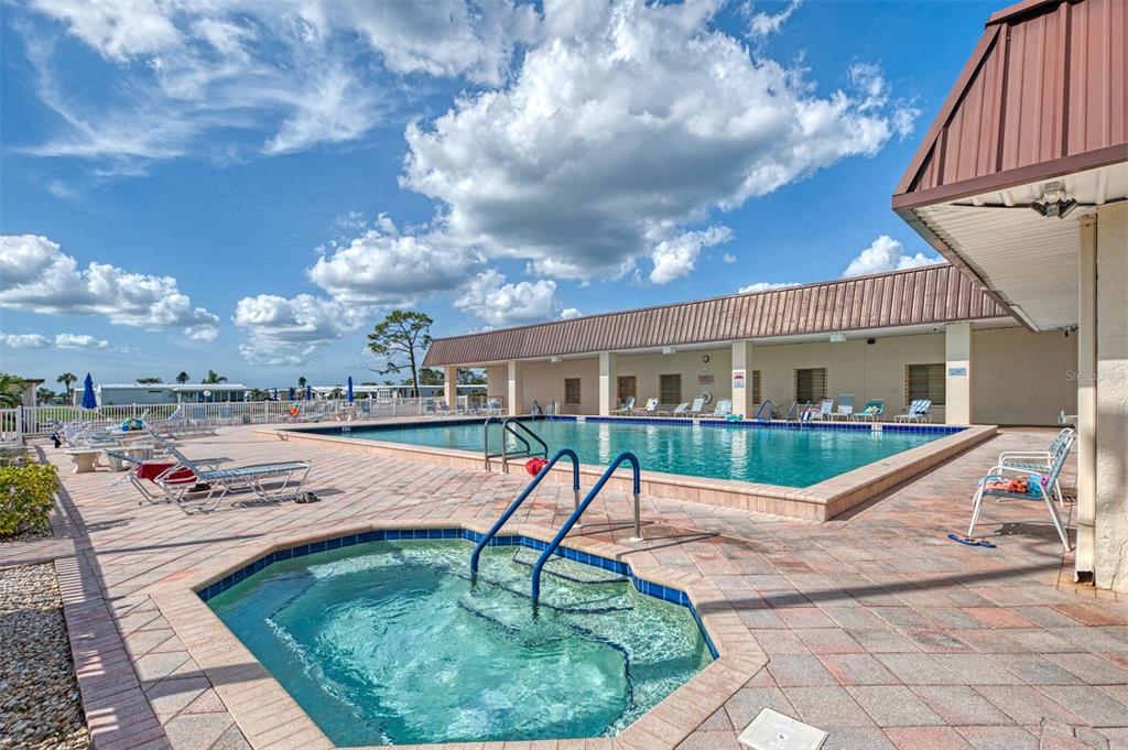 322 Robalo North Port, FL 34287 - Photo 49 of 57 a swimming pool with outdoor seating yard and barbeque oven