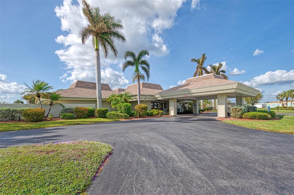 322 Robalo North Port, FL 34287 - Photo 50 of 57 a front view of a house with a yard and potted plants