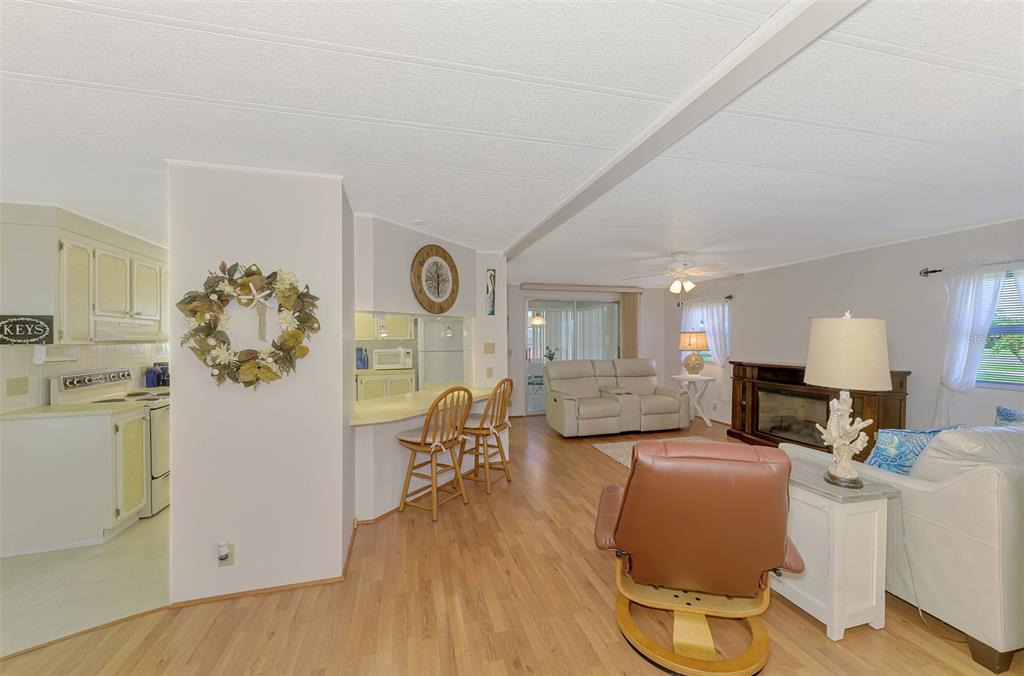 322 Robalo North Port, FL 34287 - Photo 5 of 57 a living room with furniture a couch and a flat screen tv