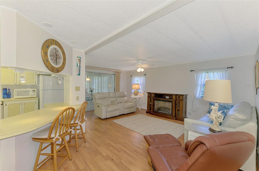 322 Robalo North Port, FL 34287 - Photo 6 of 57 a living room with furniture and a fireplace