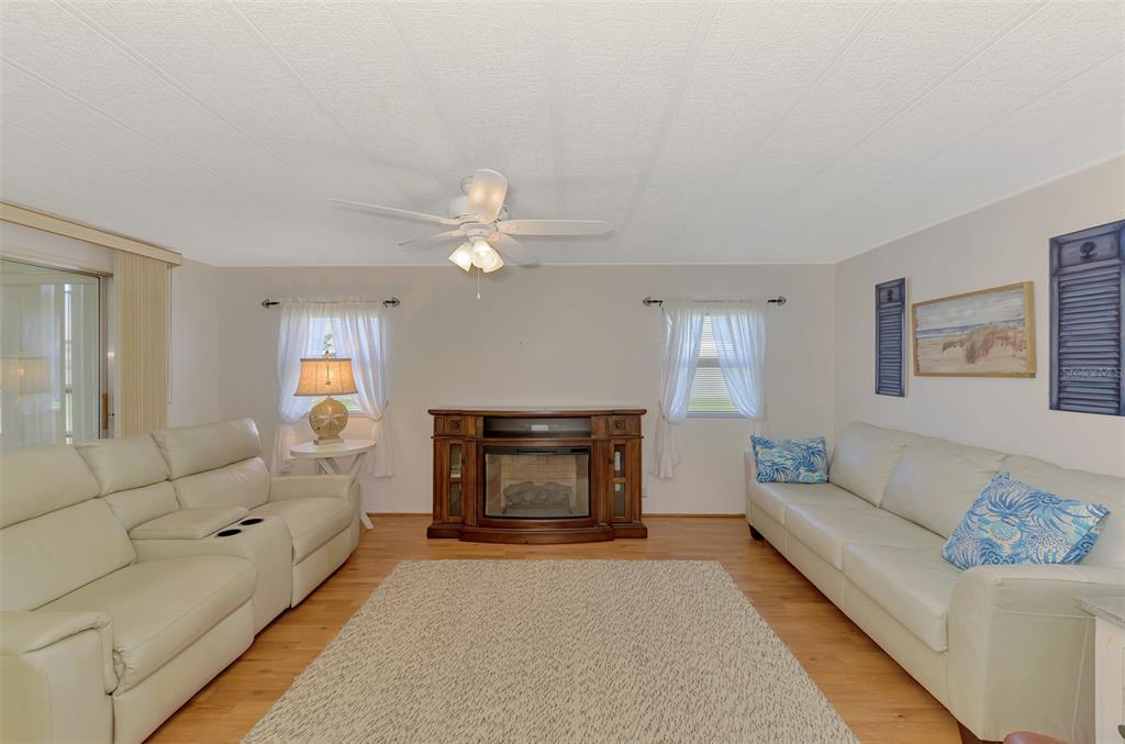 322 Robalo North Port, FL 34287 - Photo 7 of 57 a living room with furniture and a couch