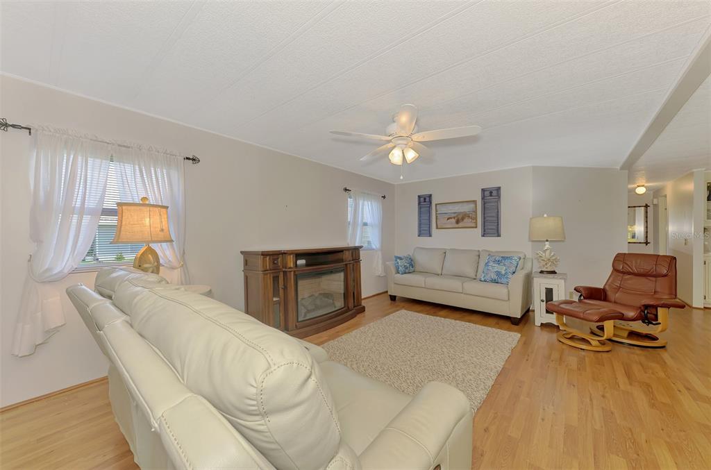 322 Robalo North Port, FL 34287 - Photo 9 of 57 a living room with furniture and a flat screen tv
