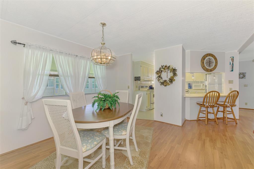 322 Robalo North Port, FL 34287 - Photo 10 of 57 a view of a dining room with furniture window and wooden floor