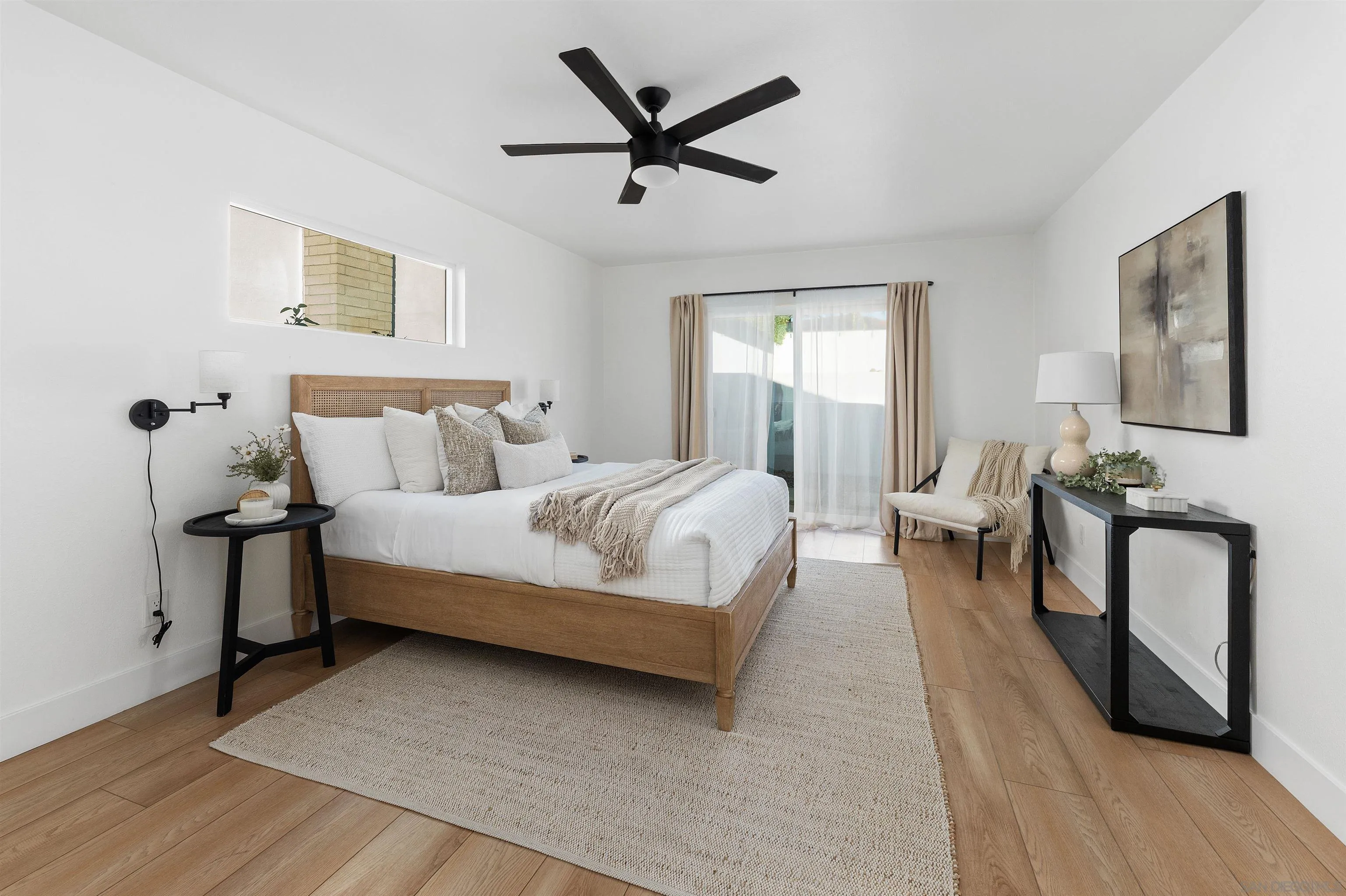 2103 Garfield Road San Diego, CA 92110 - Photo 15 of 34 a bedroom with bed couch and window