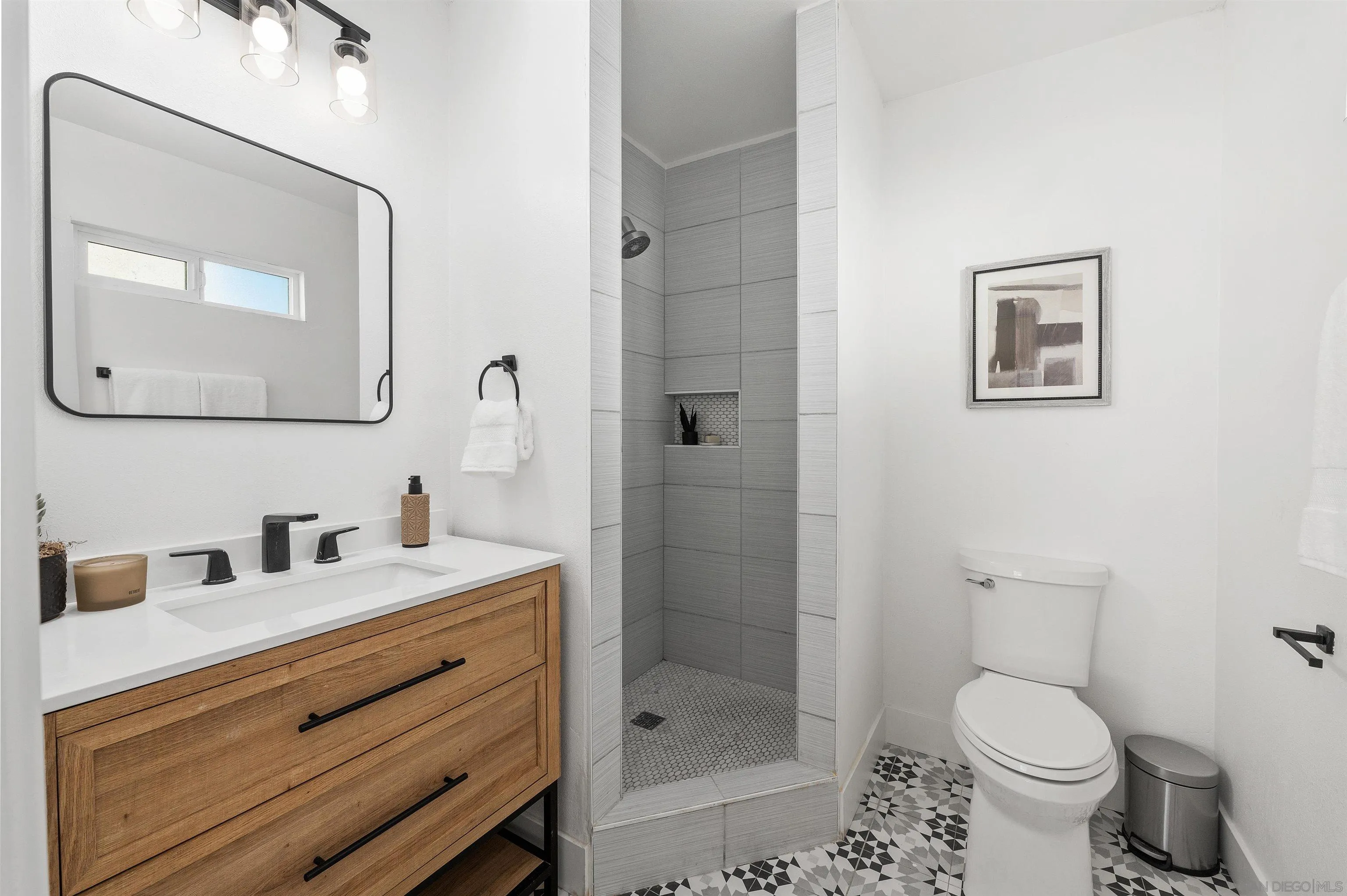 2103 Garfield Road San Diego, CA 92110 - Photo 19 of 34 a bathroom with a toilet sink and shower