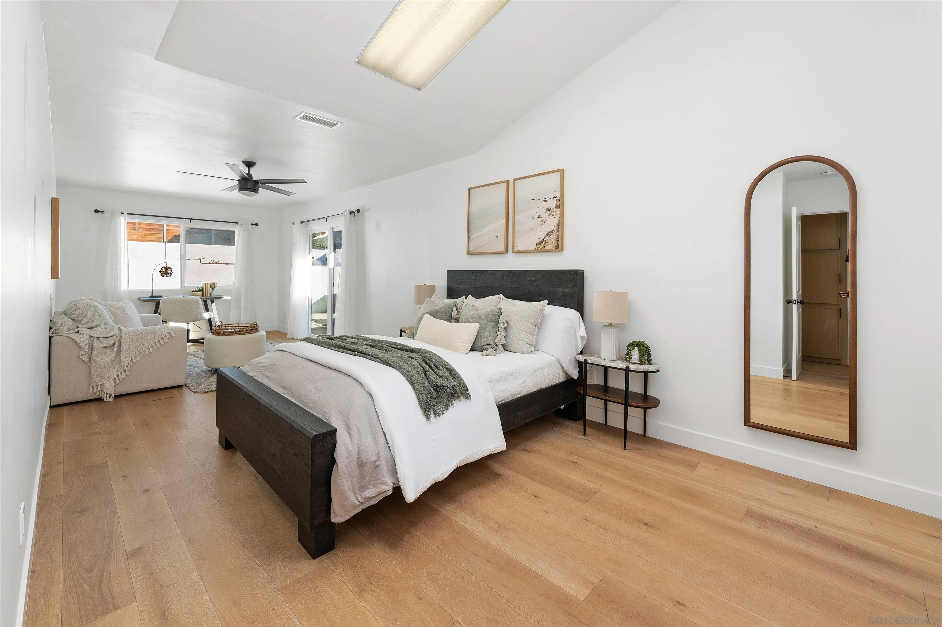 2103 Garfield Road San Diego, CA 92110 - Photo 22 of 34 a spacious bedroom with a bed and a couch