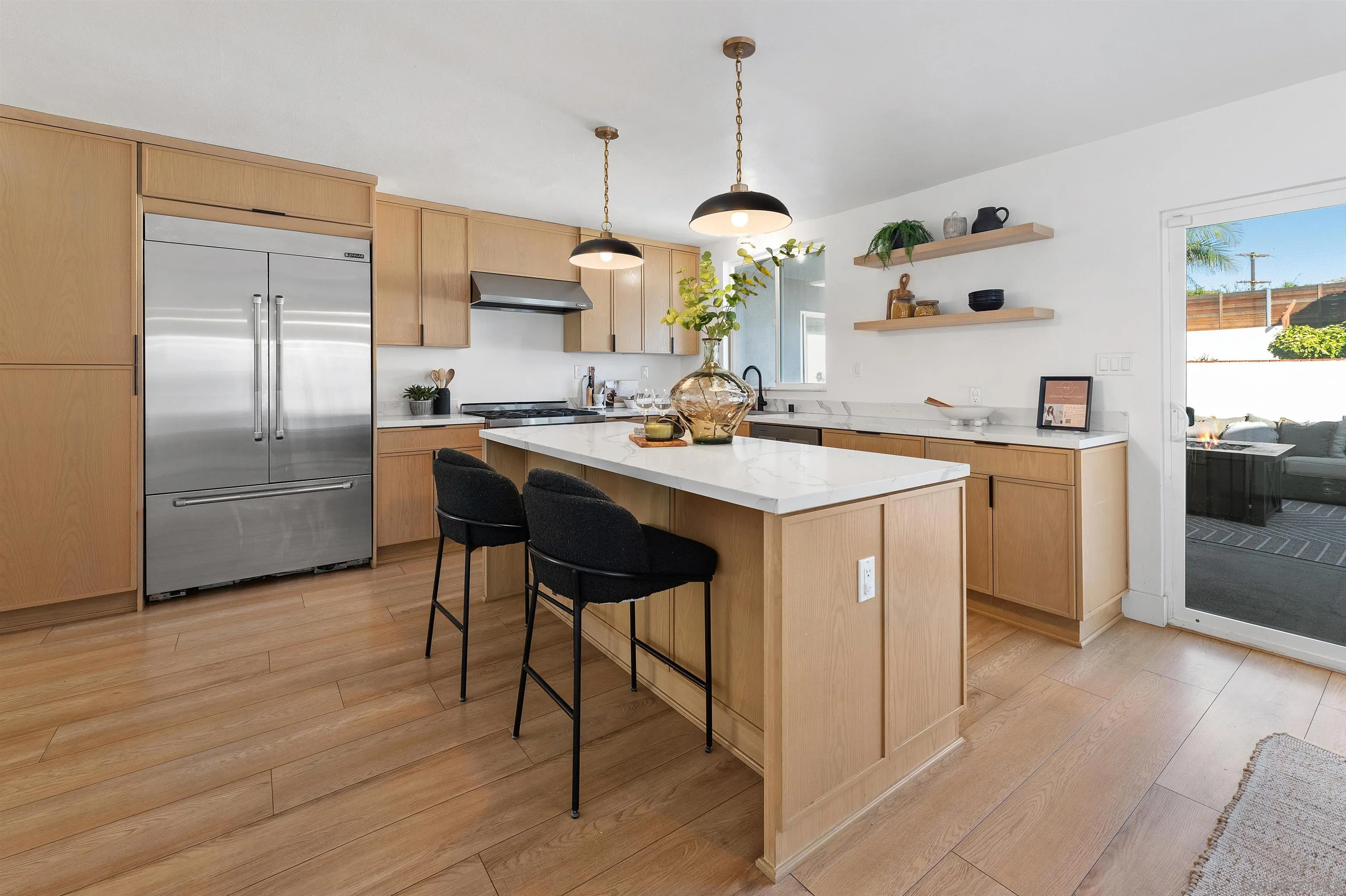 2103 Garfield Road San Diego, CA 92110 - Photo 9 of 34 a kitchen with stainless steel appliances a sink a stove a refrigerator and wooden floor
