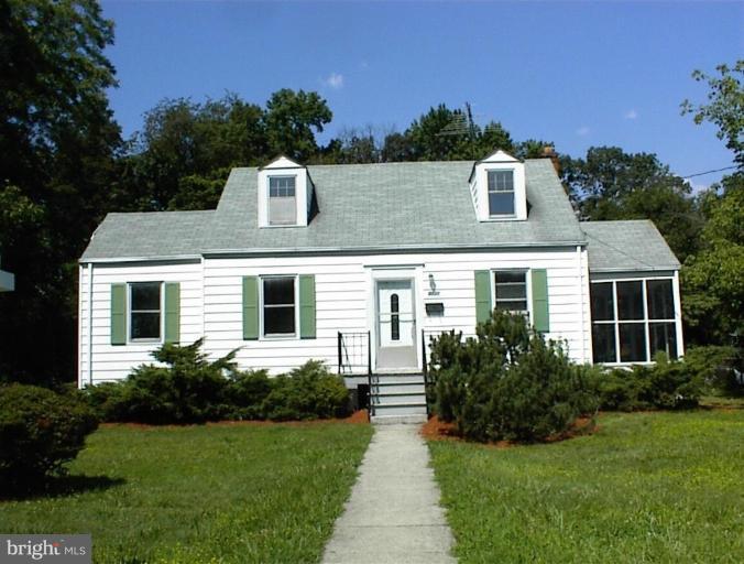 4133 Maple Road Suitland, MD 20746 - Photo 1 of 10 a front view of a house with a yard