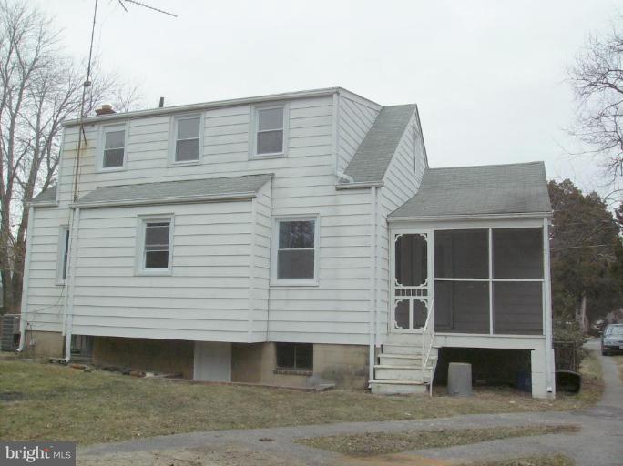 4133 Maple Road Suitland, MD 20746 - Photo 2 of 10 a front view of a house with a yard