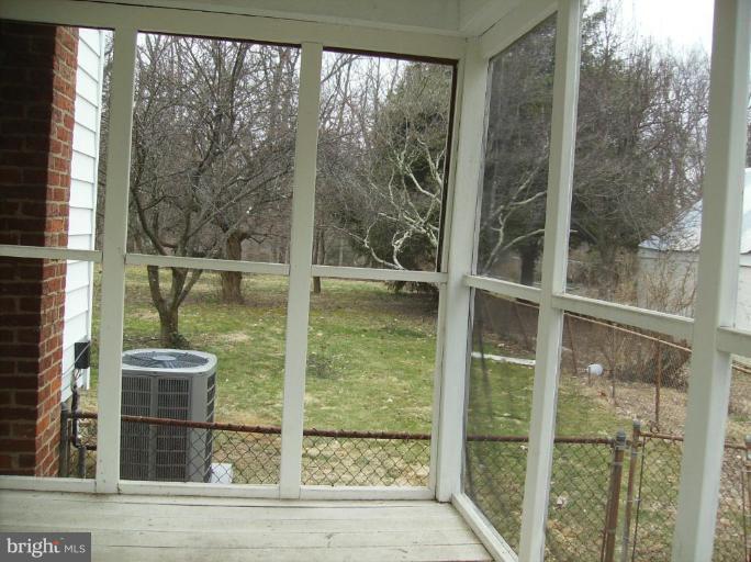 4133 Maple Road Suitland, MD 20746 - Photo 4 of 10 a view of a glass door with a yard from a window