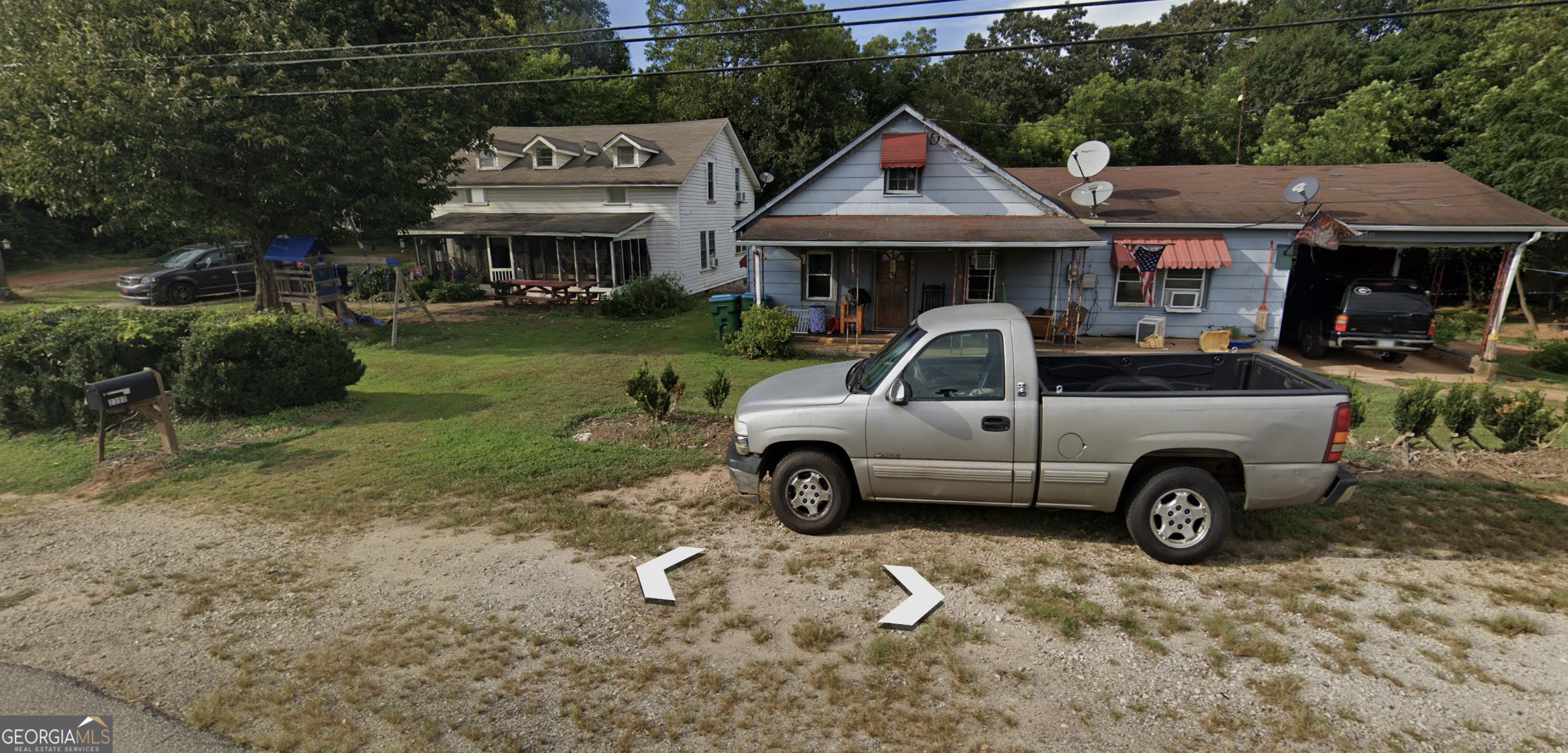 2394 West Main Street Royston, GA 30662 - Photo 2 of 5 a view of a car parked in front of a house