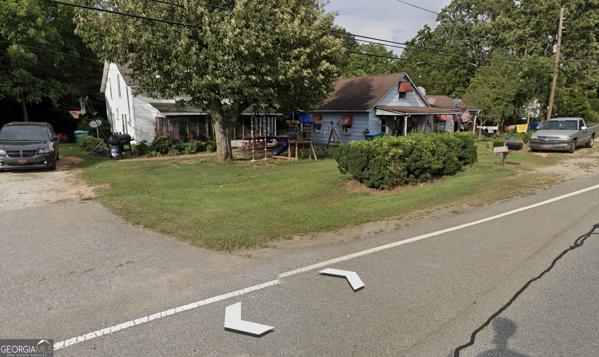 2394 West Main Street Royston, GA 30662 - Photo 4 of 5 a front view of a house with a yard